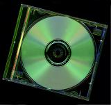 CD or DVD disc in a plastic case viewed close up from above in a technology and data storage concept