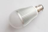 LED electric light bulb with bayonet fitting lying on its side on white in a concept of eco-friendly efficient power and energy