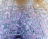 Electronic circuit layout on purple color board close-up full frame image
