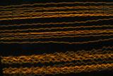 Orange noise lines on a CRT oscilloscope screen