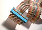 Coiled rainbow colored floppy disk ribbon cable