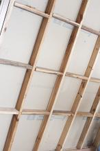 Wall studding with timber framework for attaching plasterboard during construction