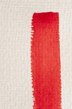 Single vertical red watercolor paint brushstroke on a textured white paper with copy space in a conceptual image of art and creativity