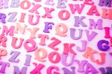 Random pretty pink alphabet numbers in uppercase for teaching preschooler and kindergarten children their alphabet and to read and write