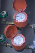 a pair of hot and cold water meters