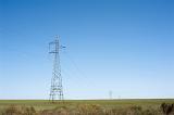an metal pylon or electricity tower in a pristine rural landscape