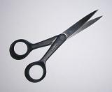 Close up view of sharp scissors with black rounded handles against a white background