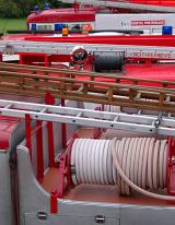 fire hose reels on top of a fire engine