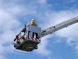 a firefigher on a rescue hoist platform