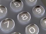 Close up detail of a numerical keypad with raised translucent buttons and white numbers