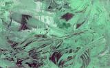 Close up view on fractured swirling green glass as abstract background with copy space