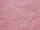 Full frame wrinkled pink paper background used for gift wrap or artwork with copy space