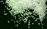 Light green circular silica gel pieces scattered on black background with copy space underneath