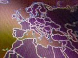 Close up on digital map of western Europe and northern Africa in purple and orange colors