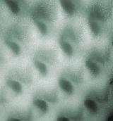Close up on fine textured gray bumpy foam package padding for abstract shapes with copy space