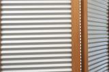 Corrugated steel and finished wood frame barrier for privacy or concealment with copy space