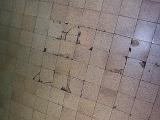 Set of broken or chipped square tiles in floor or ceiling with copy space for concept about disuse