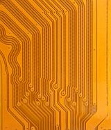 Long lines of circuit wires and terminals in gold color as computer electronics technology background