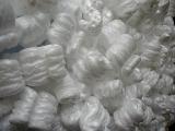 Background composed of foam packing material clustered together in on giant heap