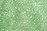 Background texture of light green bubble wrap for use in packaging for providing protection, full frame view