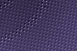 Top down view on full frame background of round purple dimple textures with copy space