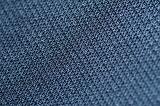 Top down selective focus close up view of blue fabric in diagonal lines as abstract textured background