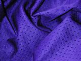 Blue folded breathable athletic wear fabric with air holes as abstract background for sports concept