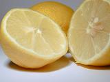 Halved fresh juicy tangy lemon rich in vitamin c used as a garnish, salad dressing and aromatic acidic cooking ingredient