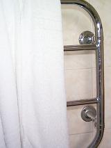 an electric towel rail with white towel on it