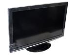 Modern flat black TV set or PC monitor with wide LCD screen turned off, close-up with copy space on white