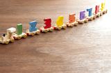 An old fashioned toy wooden train with numbers on each car
