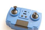 Close up of generic blue electronic toy controller made from two joysticks, buttons and slide switches with copy space over white background