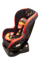 Isolated Cut Out of Child Car Safety Seat with Colorful Striped Cushion in Studio with White Background and Copy Space
