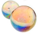 Close up of two toy marbles with clear and violet designs on isolated background