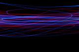random lightpainted scribbles of crisscrossing blue and red lines