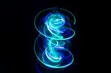 a spinning light painted effect with vivid swirls of curved cyan and blue light