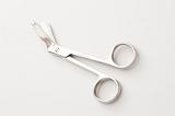 Single partially open stainless steel gauze scissors on white background with set down shadow