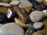 highly polished smooth stones in assorted colours and shapes
