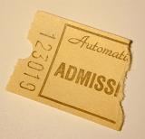 Torn numbered admission ticket with the word automatic printed on it allowing entry to a venue