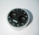 High Angle View of Kitchen Timer with Black Face and White Numbers on White Background