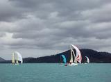 four yachts racing on a stormy looking day