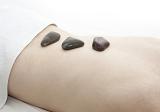 pampering tense muscles with a hot stone back massage