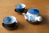 relaxing the body - tea cups and a teapot for a refreshing cup of green tea