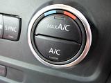 Climate control knob on a car dashboard with heating, cooling and air conditioning